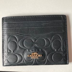 Coach Signature leather card case with brass carriage logo